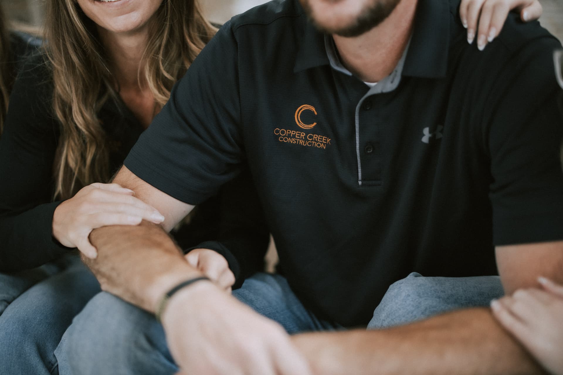 Copper Creek Construction embroidered logo on team apparel
